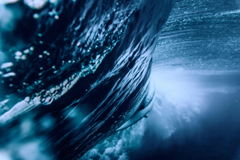 a man riding a wave on top of a surfboard, pexels contest winner, surrealism, the blue whale crystal texture, ominous depths, blurred, instagram post