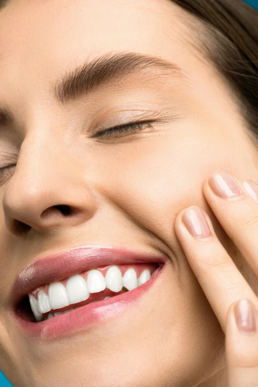 a close up of a person holding a toothbrush, smiling fashion model face, chiseled features, wide nostrils, dimples