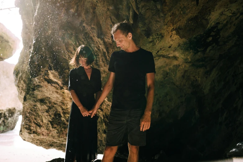 a man and a woman standing in a cave, lachlan bailey, portrait image