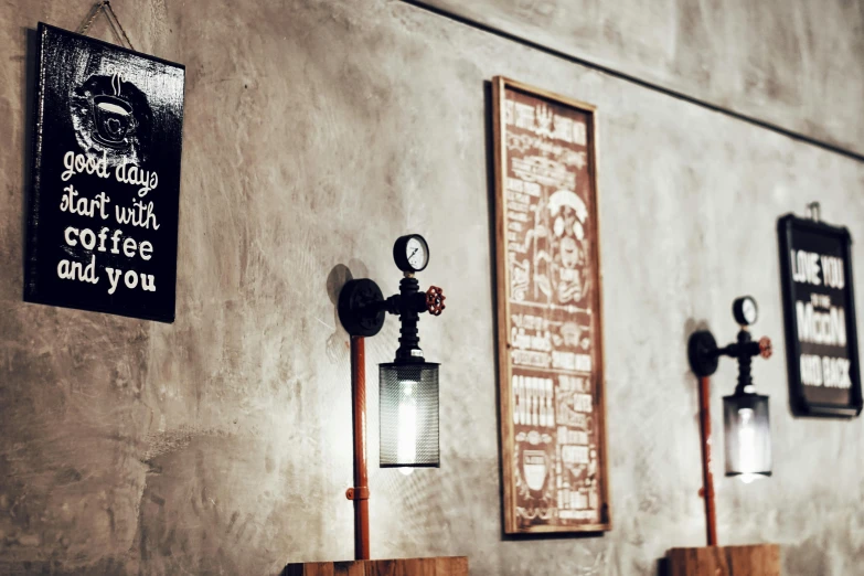 a row of lights mounted to the side of a wall, inspired by Brassaï, unsplash, graffiti, a pint of beer sitting on a bar, made of intricate metal and wood, sconces, desaturated