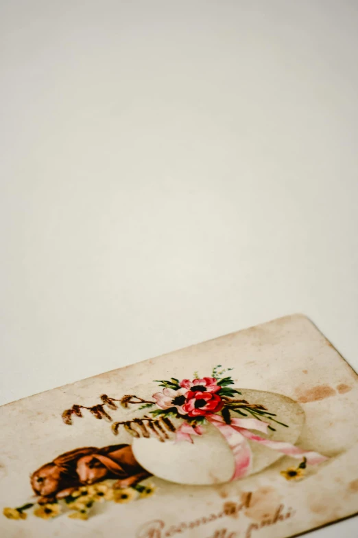 a close up of a small box on a table, an album cover, by Ruth Simpson, romanticism, antique, on white paper, 15081959 21121991 01012000 4k, museum quality photo