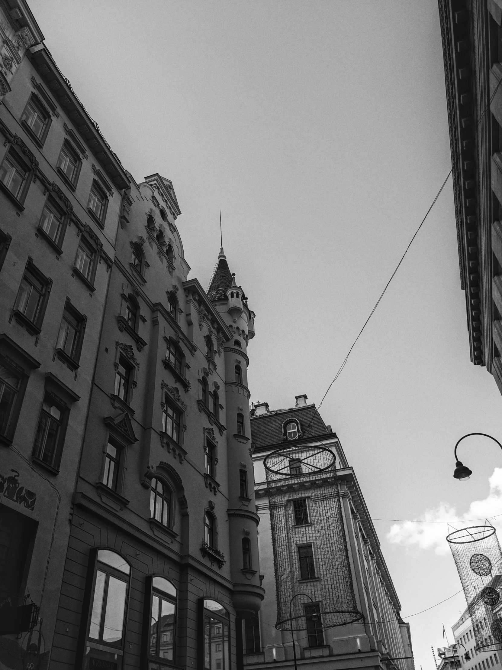 a black and white photo of a clock tower, by Sebastian Spreng, stockholm city, view from the street, vesa-matti loiri, anna nikonova