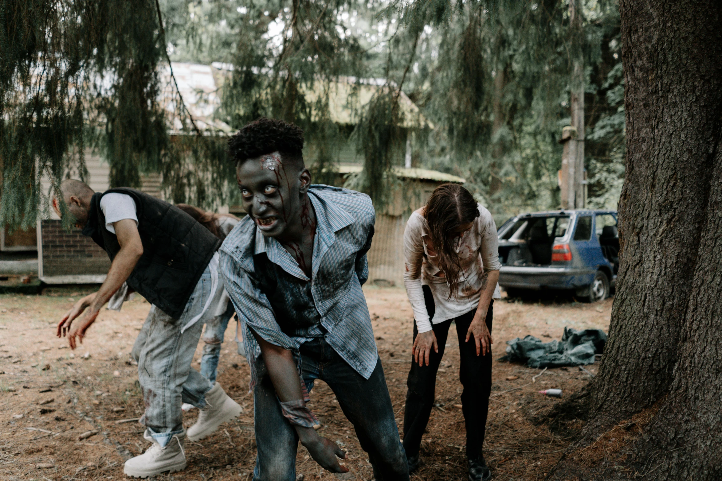 a group of people that are standing in the dirt, violent zombie dance, black teenage boy, gen z, college