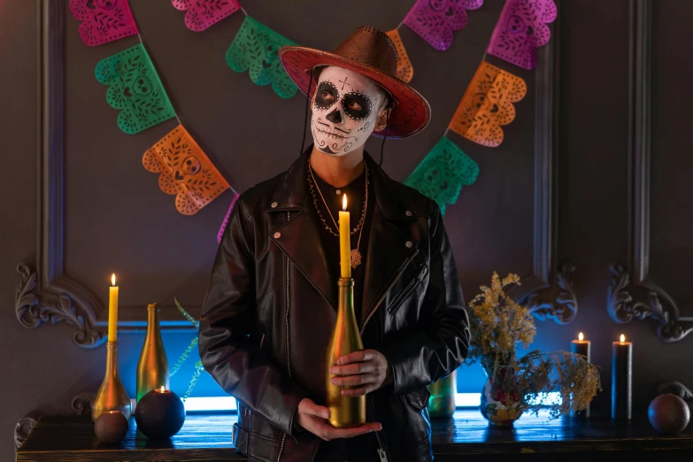 a man in a mexican costume holding a bottle of beer, pexels contest winner, vanitas, room full of candles, profile image, leather clothing, a person standing in front of a