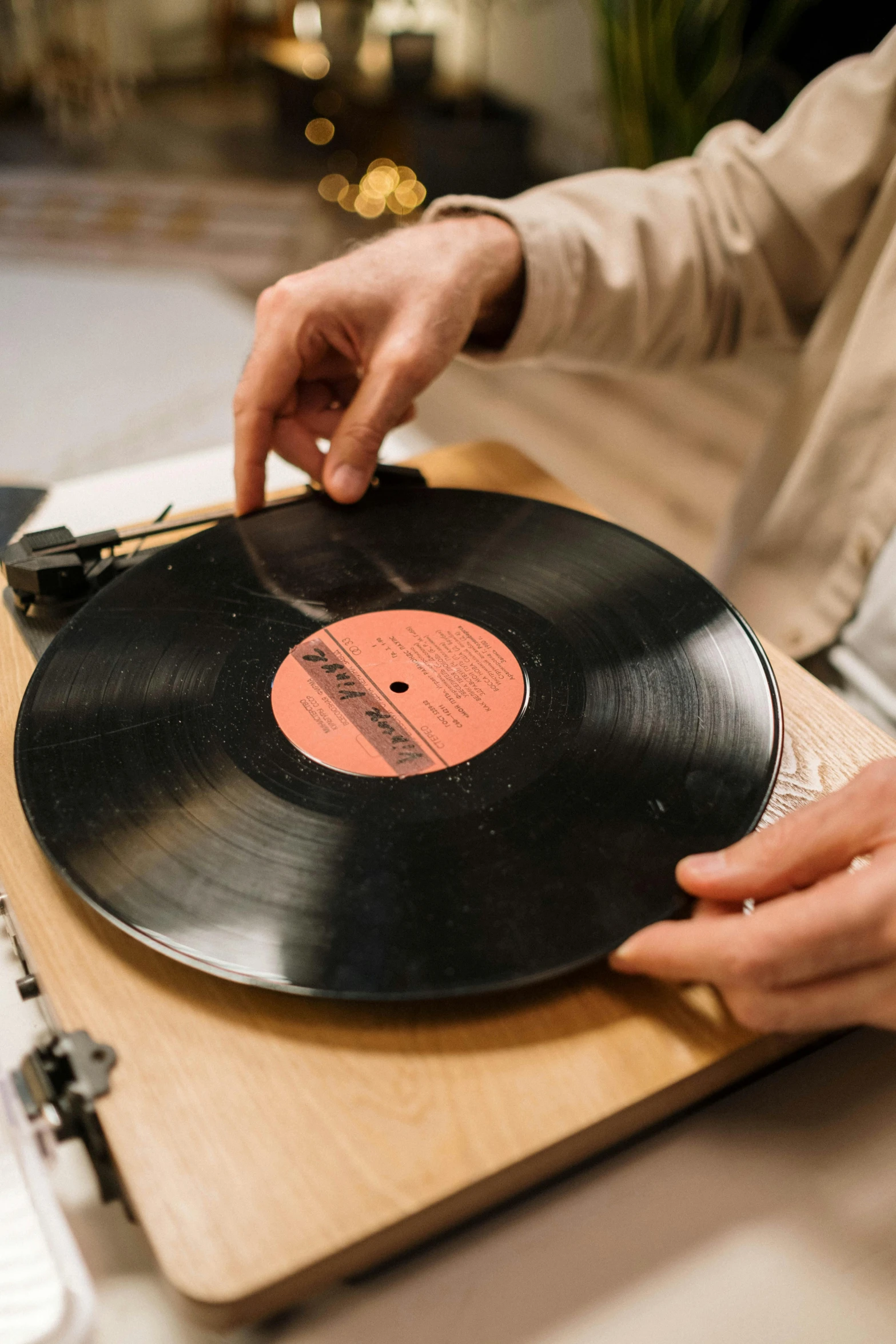 a person holding a record on a cutting board, by Ottó Baditz, recreation, music phd, belgium, engineered