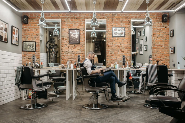a man sitting in a chair in a barber shop, trending on pexels, lyco art, profile image, anna nikonova, panoramic shot, fan favorite