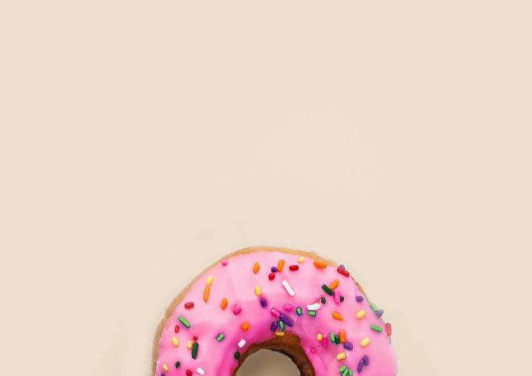 a donut with pink frosting and sprinkles, by Daniel Seghers, trending on pexels, wallpaper mobile, minimalist photo, 15081959 21121991 01012000 4k, juicy color