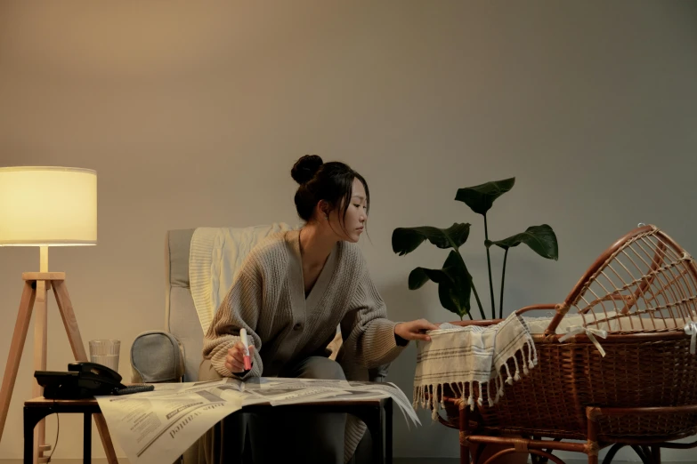 a woman sitting in a chair reading a book, inspired by Kim Tschang Yeul, wearing a linen shirt, tending on art station, long cinematic shot, daily life