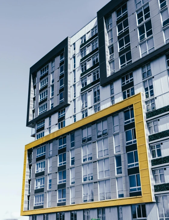 a green fire hydrant sitting in front of a tall building, by Carey Morris, pexels contest winner, modernism, silver and yellow color scheme, apartment complex made of tubes, blue and yellow, rectangle