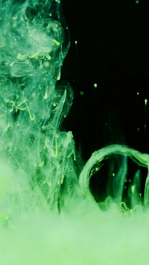 a close up of a green substance in water, a microscopic photo, by Otto Piene, pexels, hair made of shimmering ghosts, still from film, tentacled creature mix, white neon wash