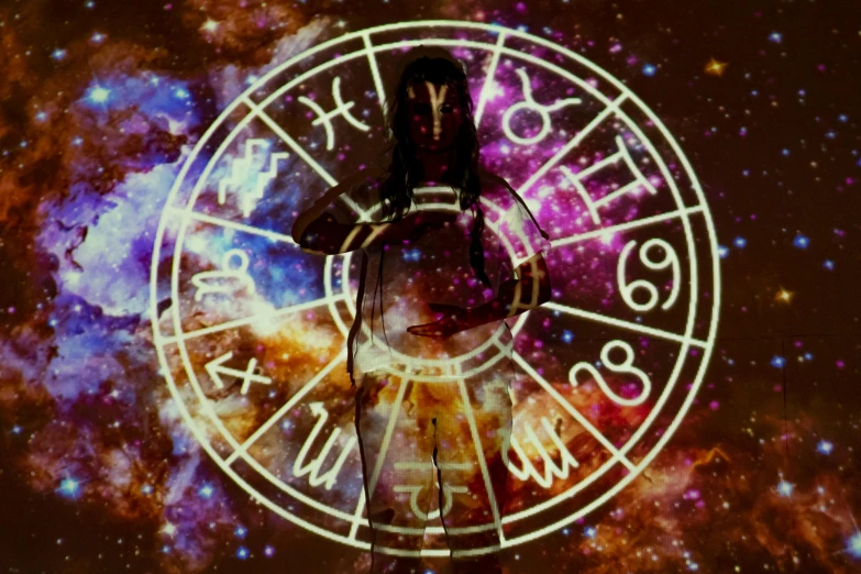 a man that is standing in front of a clock, a digital rendering, trending on pexels, psychedelic art, zodiac libra sign, glowing aura around her, witchy clothing, star charts