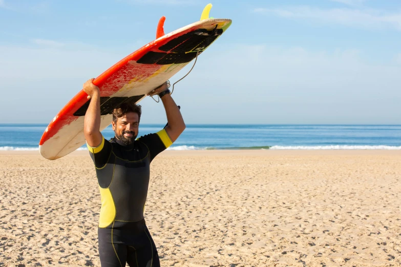 a man holding a surfboard on top of his head, on the sand, avatar image, sports photo, zoomed in