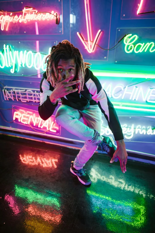 a man kneeling on the ground in front of neon signs, trending on pexels, graffiti, dreads, actress, yzy gap, detailed »