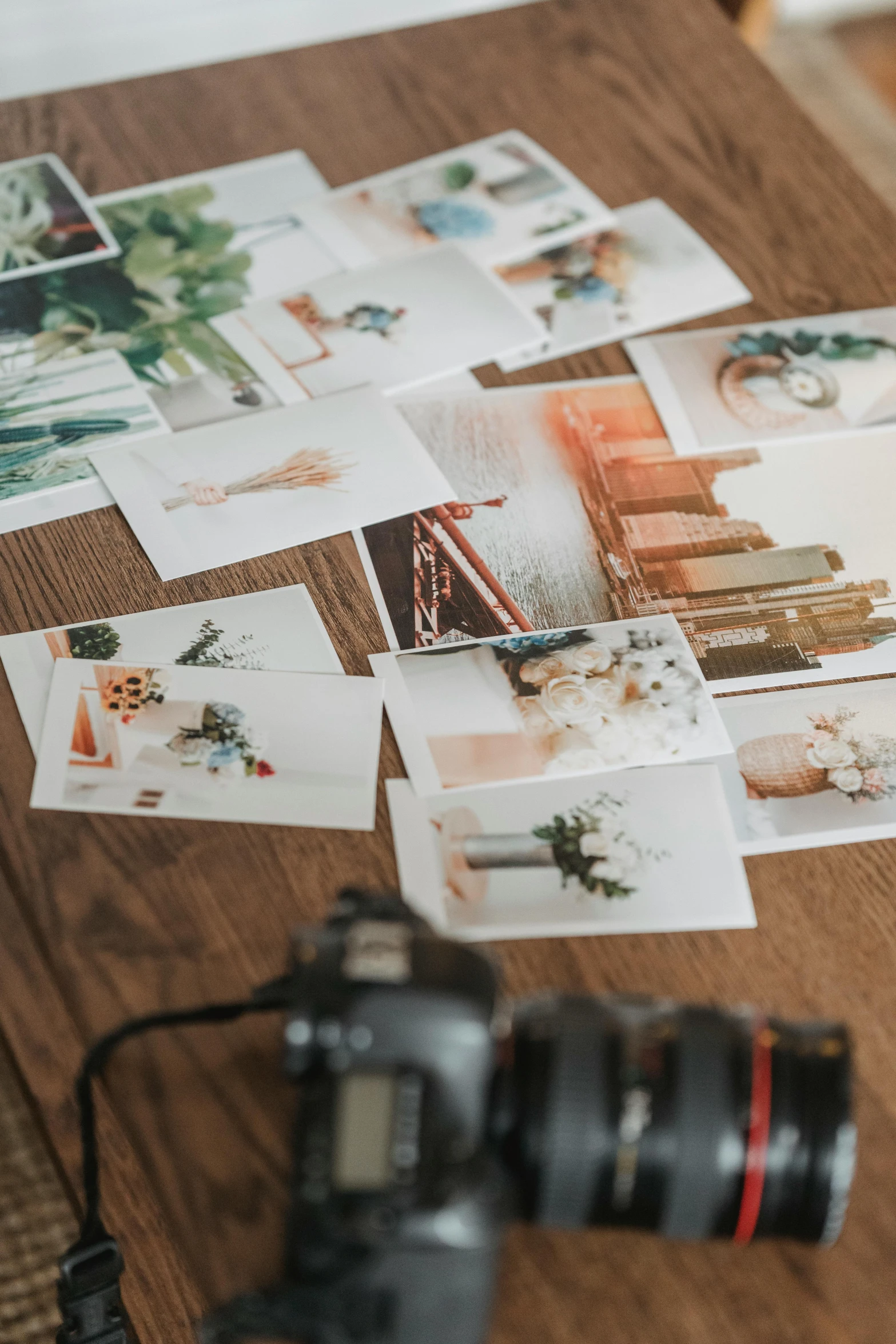 a camera sitting on top of a wooden table, a picture, trending on pexels, art photography, papers on table, colour print, photo collage, stacked image