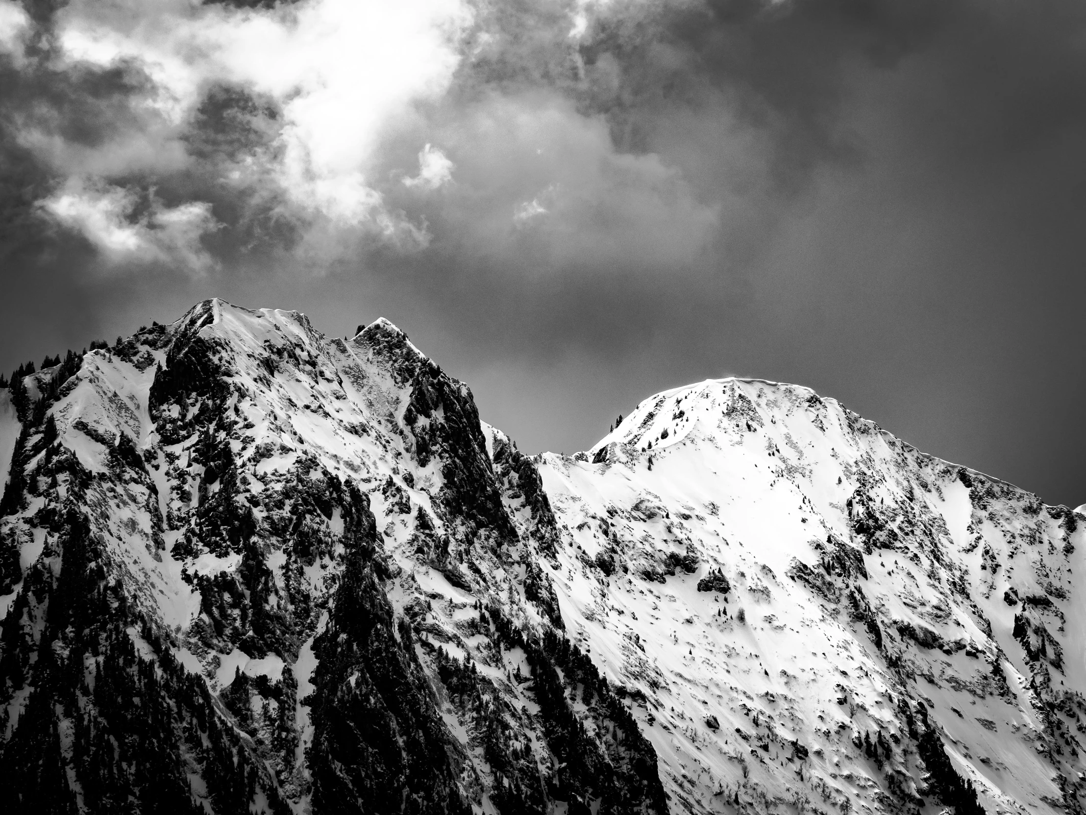 a black and white photo of a snow covered mountain, a black and white photo, by Matthias Weischer, unsplash, baroque, fine art print, dramatic lighting - n 9, high contrast!!, high contrast 8k