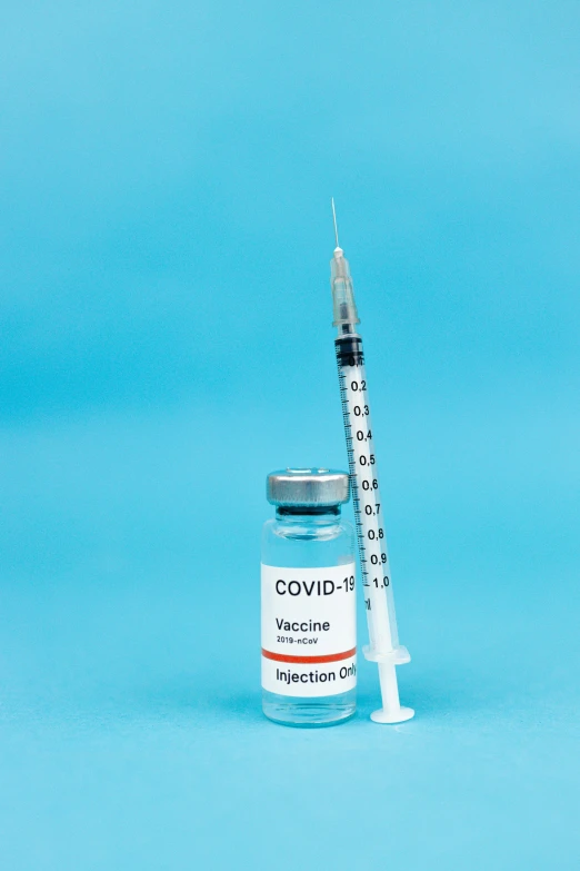 a syll and a vaccine on a blue background, by Gavin Hamilton, shutterstock, instagram post, coronavirus, color picture, ava max