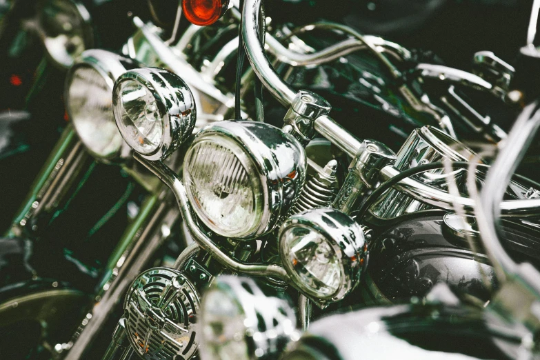 a group of motorcycles parked next to each other, by Adam Marczyński, unsplash, photorealism, intricate chrome headdress, car lights, close up details, ilustration