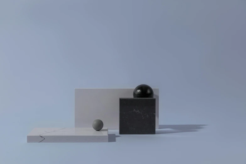 a black ball sitting on top of a white box, a 3D render, inspired by Richard Wilson, polycount, postminimalism, blue marble, scattered props, architectural scale, minimal palette