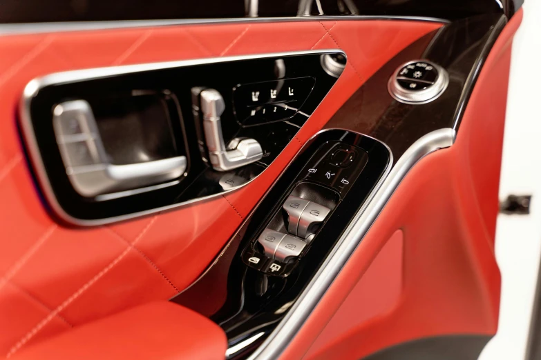 a close up of the interior of a car, a digital rendering, inspired by Bernardo Cavallino, trending on pexels, red mechanical body, chrome accents, thumbnail, beautiful sculpted details