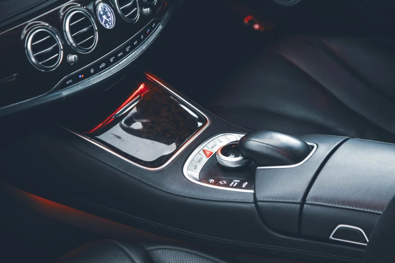 a close up of the interior of a car, by Elsa Bleda, pexels contest winner, red accents, mercedez benz, controls, header text”