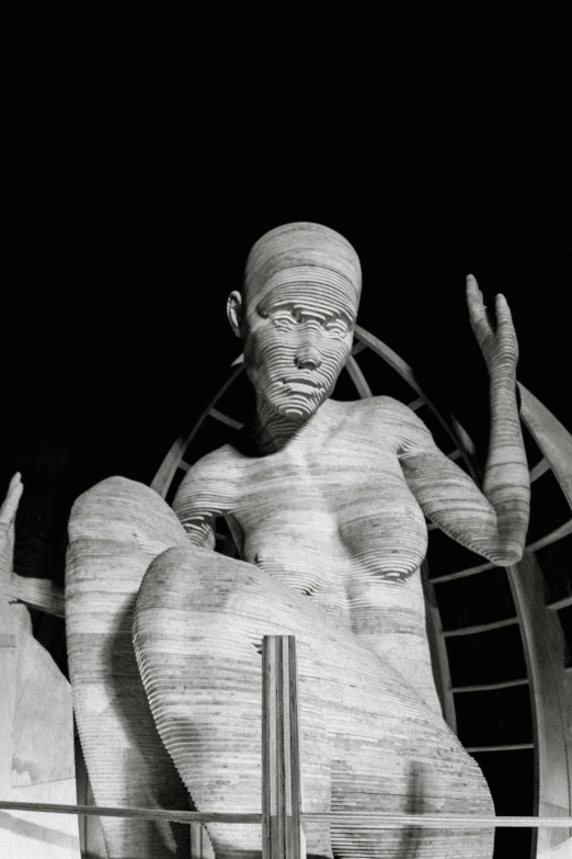 a black and white photo of a statue, a surrealist sculpture, featured on zbrush central, an amusement park in old egypt, the fifth element, taken in the night, detailed body structure