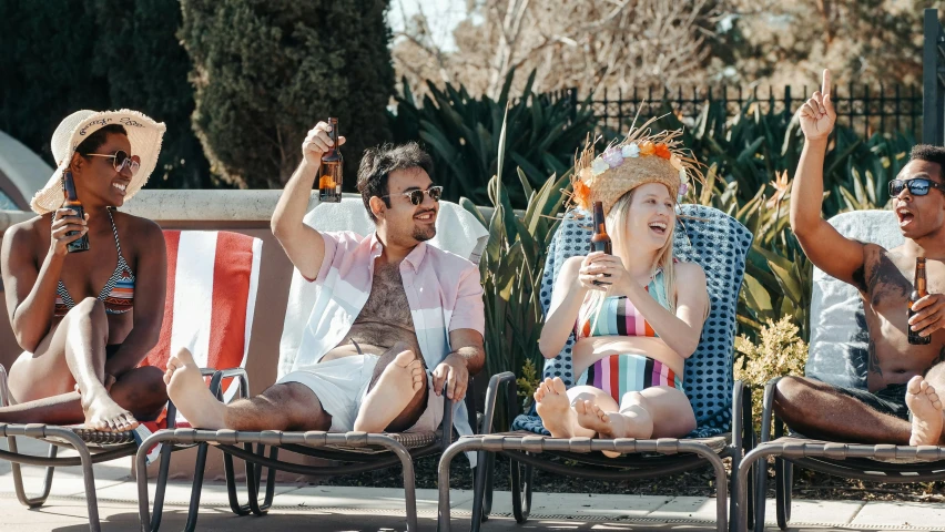 a group of people sitting next to each other on lawn chairs, by Lee Loughridge, pexels, pool party, medium shot of two characters, holding beer bottles, sydney sweeney