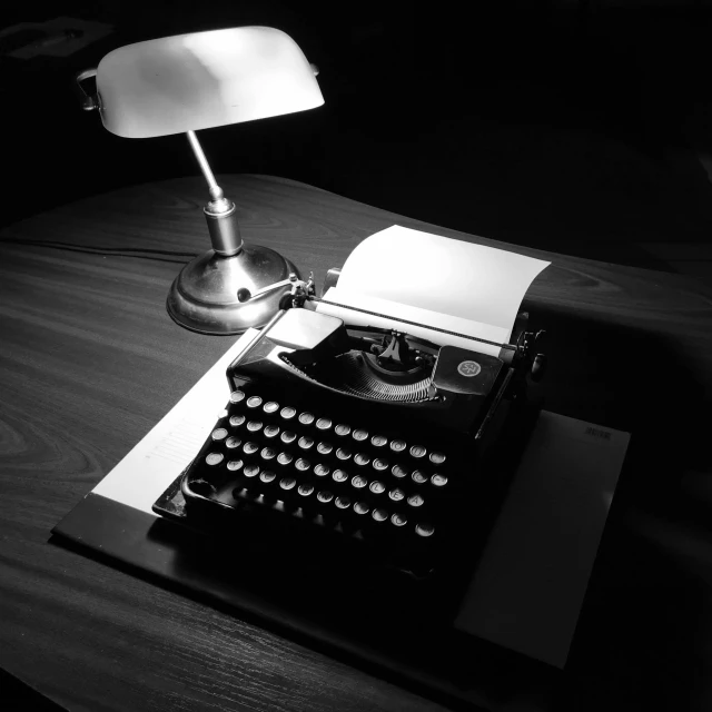 a black and white photo of an old typewriter, a black and white photo, figuration libre, shining lamp, monochrome:-2, commission, table light