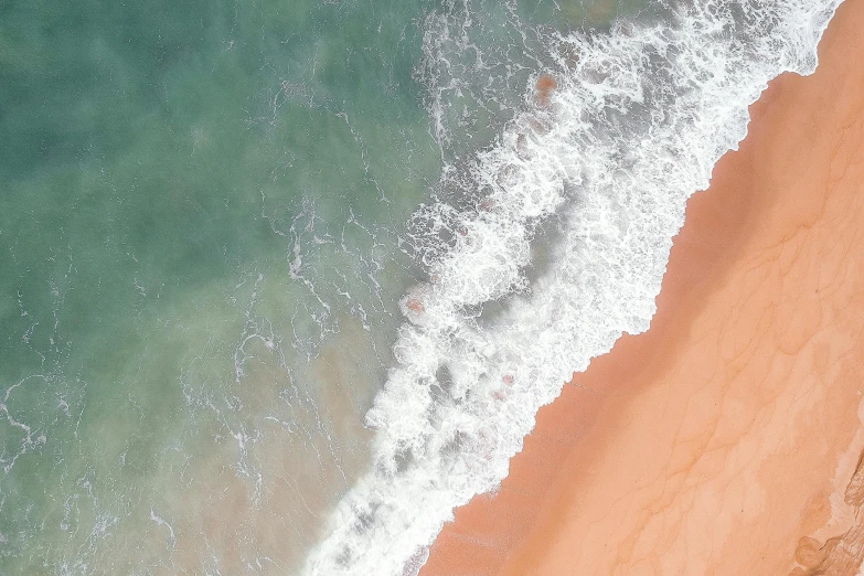 a person riding a surfboard on top of a sandy beach, pexels contest winner, minimalism, flowing salmon-colored silk, helicopter view, cresting waves and seafoam, iphone wallpaper