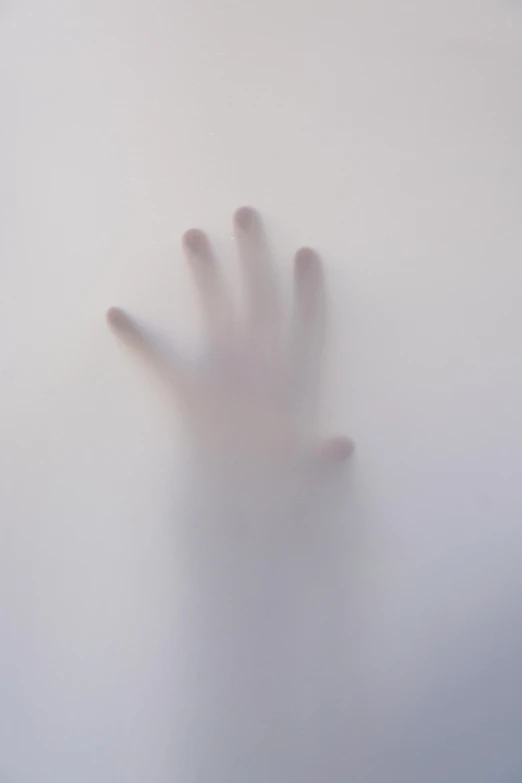 a close up of a person's hand on a frosted surface, by Emily Shanks, unsplash, conceptual art, fog volume, white body, terrified, ignant