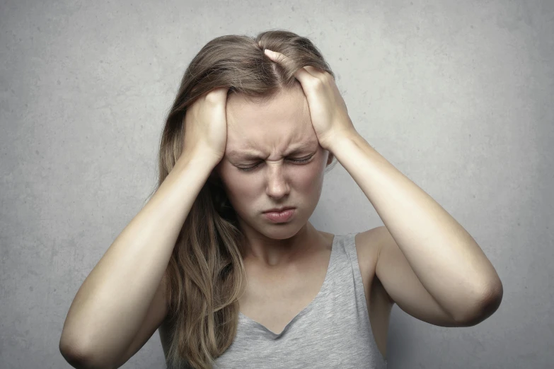 a woman holding her head in her hands, incoherents, injured, promo image, instagram picture, various posed