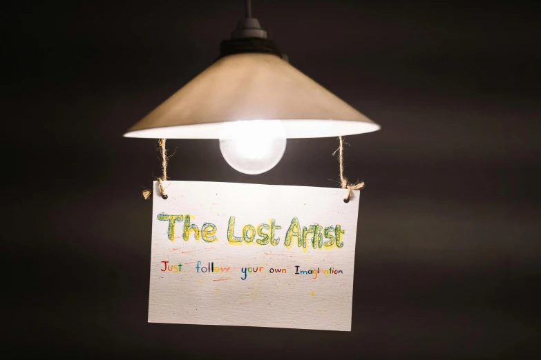 a sign that says the lost africa hanging from a light fixture, an album cover, inspired by Tracey Emin, pexels contest winner, children's artwork, the, justin todd, night light