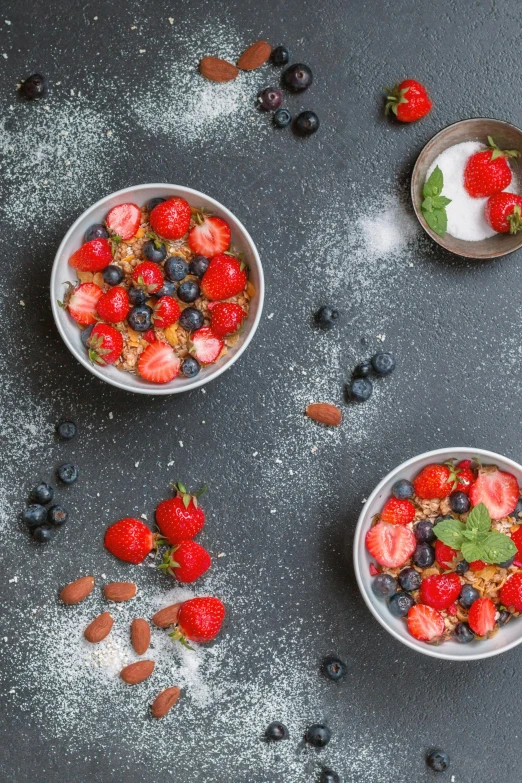 bowls of granola with strawberries, blueberries and almonds, by Andries Stock, trending on unsplash, renaissance, made of glazed, grain”, studio photo, high quality product image”