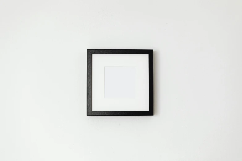 a picture frame sitting on top of a white wall, square, black lacquer, saatchi art, high quality image