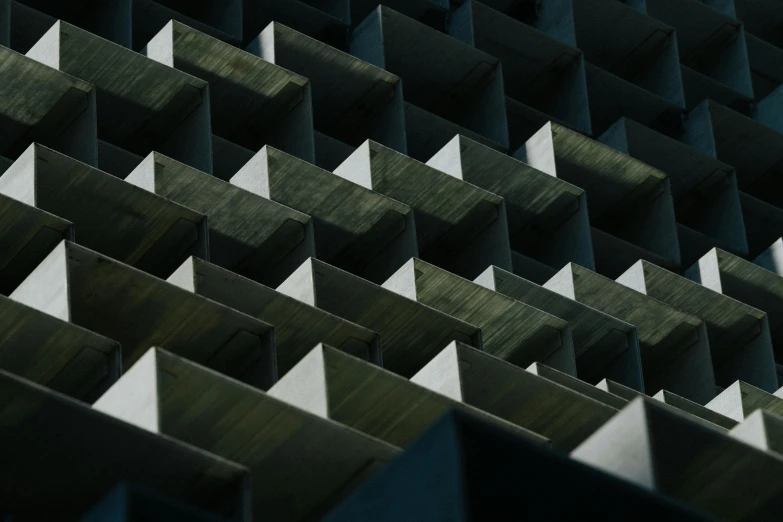 a close up of the side of a building, inspired by Peter Zumthor, unsplash contest winner, brutalism, rows of razor sharp teeth, still from a music video, cubes, unsplash photography