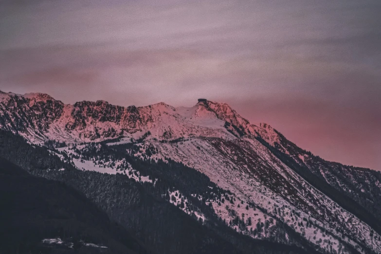 a mountain covered in snow under a pink sky, pexels contest winner, aestheticism, moody morning light, brown, low detailed, whistler