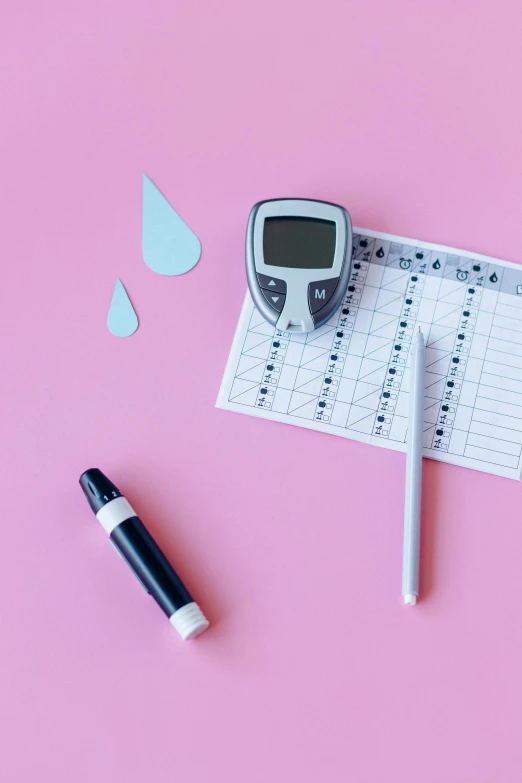 a blood sugar test and a pen on a pink background, a picture, by Julia Pishtar, trending on pexels, square, water levels, charts, diecut