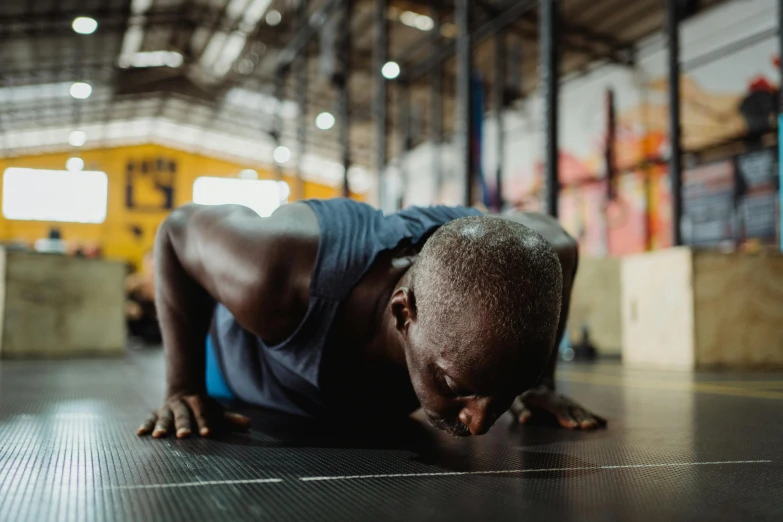 a man doing push ups in a gym, pexels contest winner, hyperrealism, unmistakably kenyan, australian, profile image, thumbnail