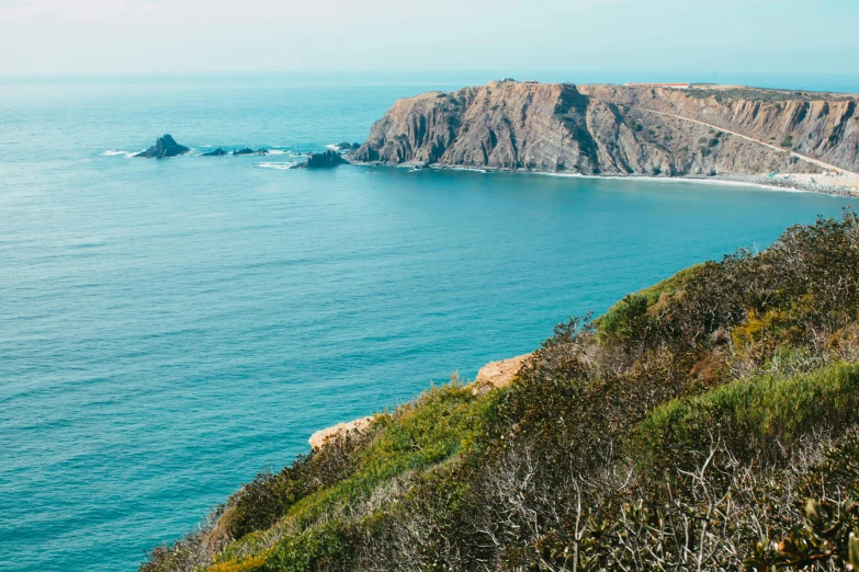 a view of the ocean from the top of a hill, pexels contest winner, bispo do rosario, turquoise ocean, thumbnail, high-quality photo