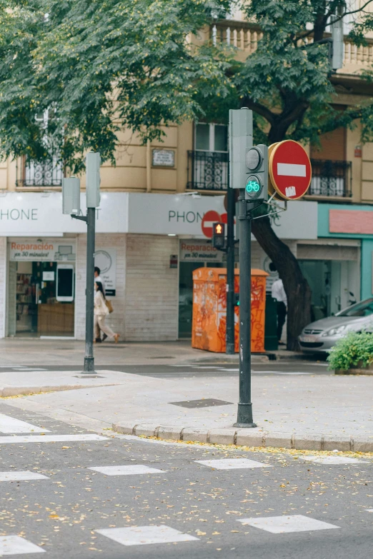 a traffic light sitting on the side of a road, an album cover, by Matteo Pérez, trending on unsplash, art nouveau, tel aviv street, apple store, wide long view, the place is just really small