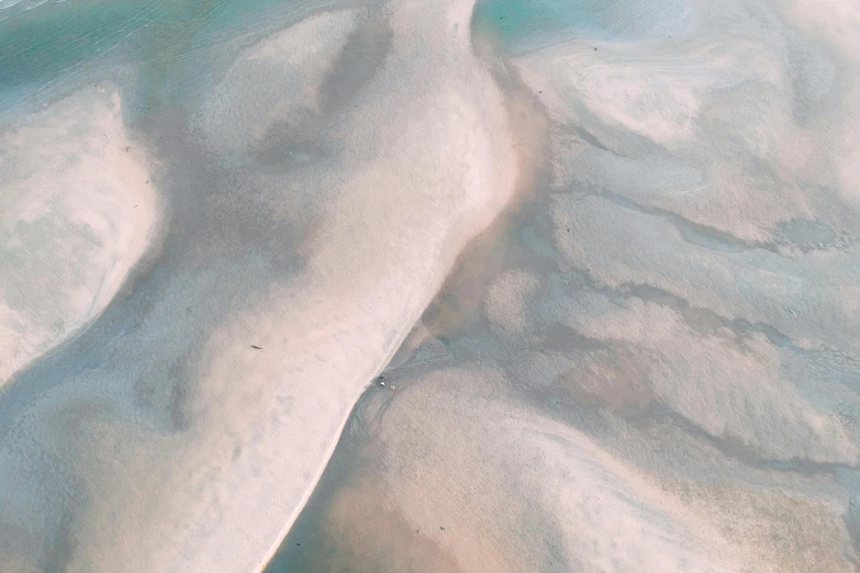 a large body of water sitting on top of a sandy beach, pexels contest winner, generative art, pink white turquoise, arial shot, abstract white fluid, great barrier reef