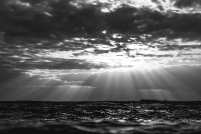 the sun shines through the clouds over the ocean, a black and white photo, inspired by Max Dupain, unsplash, romanticism, underwater light rays, dramatic light 8 k, by greg rutkowski, today\'s featured photograph 4k