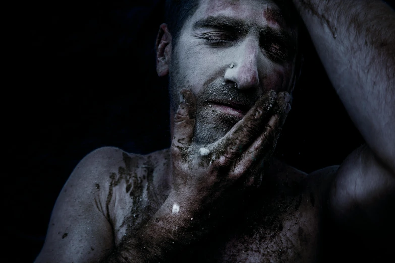 a man with mud all over his face, an album cover, by Lucia Peka, pexels contest winner, massurrealism, movie still of a tired, dark scene, h3h3, reza afshar