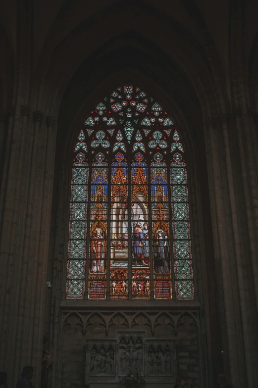 a large stained glass window in a church, a picture, by Barthélemy d'Eyck, pexels contest winner, renaissance, black and yellow and red scheme, square, low quality photo, seen from a distance