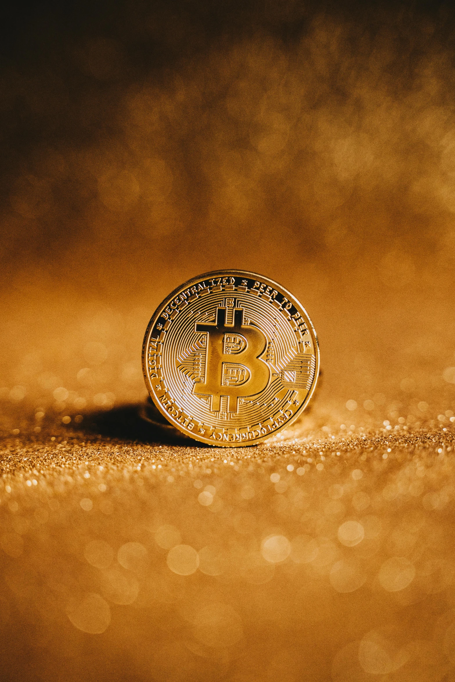 a bit coin sitting on top of a table, brown and gold, thumbnail, features, uncropped