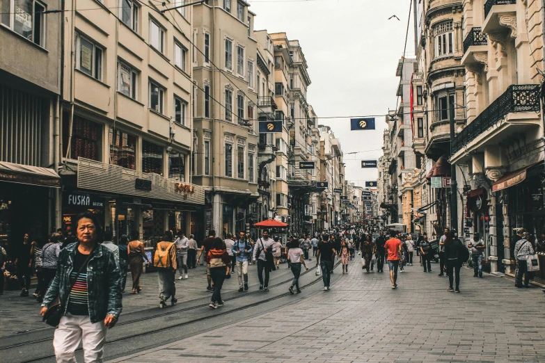 a group of people walking down a street next to tall buildings, pexels contest winner, hurufiyya, ottoman empire, thumbnail, square, lots of shops