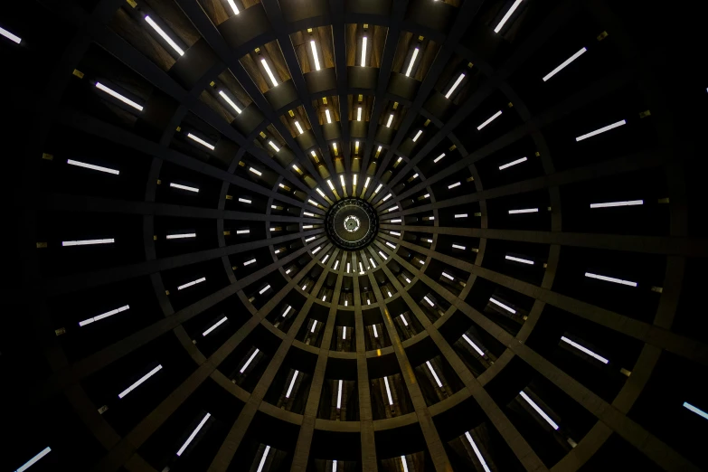 a clock that is in the middle of a building, by Matthias Stom, pexels contest winner, light and space, spaceship hull texture, star wars architecture, intricate lights, silo