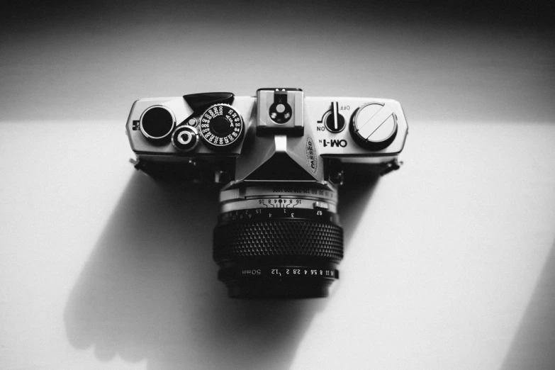 a black and white photo of a camera, by Karl Buesgen, unsplash contest winner, 1980s photography, high angle camera, 4 5 mm. photorealistic, medium format
