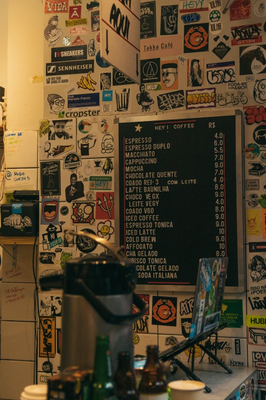 a kitchen with lots of stickers on the wall, by Niko Henrichon, trending on unsplash, graffiti, cold brew coffee ), restaurant menu photo, turntablist, two cups of coffee