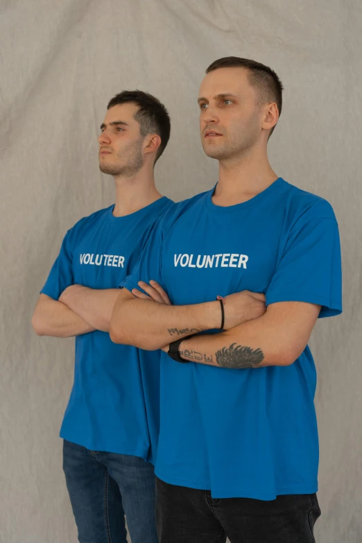 a couple of men standing next to each other, blue tight tshirt, vadim voitekhovitch, promo photo, support