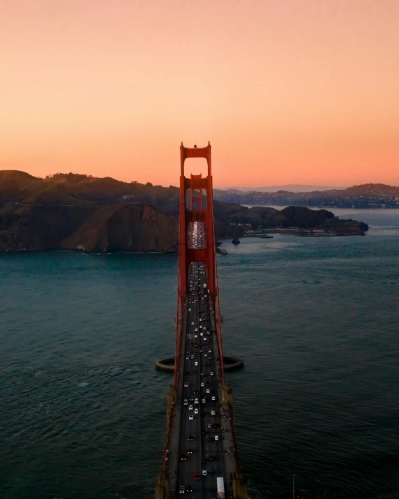 an aerial view of the golden gate bridge at sunset, a picture, by Ryan Pancoast, pexels contest winner, lgbtq, background image, 2 0 2 2 photo
